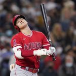 
              Los Angeles Angels' Shohei Ohtani reacts after striking out swinging to end then top of the seventh inning of a baseball game against the Seattle Mariners, Sunday, Oct. 3, 2021, in Seattle. (AP Photo/Elaine Thompson)
            