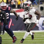 
              Tampa Bay Buccaneers running back Leonard Fournette, right, runs for a gain during the first half of an NFL football game against the New England Patriots, Sunday, Oct. 3, 2021, in Foxborough, Mass. (AP Photo/Elise Amendola)
            