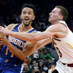 
              Phoenix Suns guard Landry Shamet, left, is fouled by Cleveland Cavaliers guard Dylan Windler (9) during the second half of an NBA basketball game Saturday, Oct. 30, 2021, in Phoenix. The Suns won 101-92. (AP Photo/Ross D. Franklin)
            