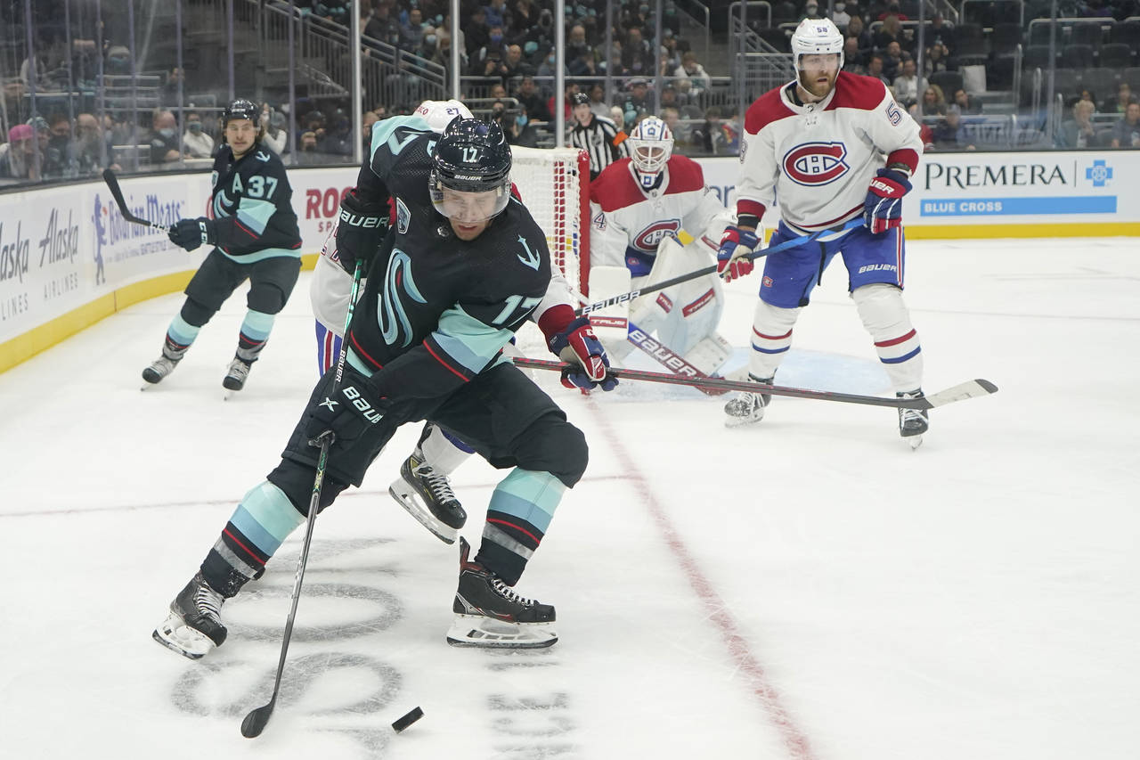 Seattle Kraken center Jaden Schwartz (17) passes the puck as Montreal Canadiens goaltender Jake All...