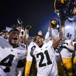 
              Iowa players celebrate after defeating Maryland 51-14 during an NCAA college football game, Friday, Oct. 1, 2021, in College Park, Md. (AP Photo/Julio Cortez)
            
