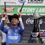 
              Kyle Larson (5) celebrates after winning a NASCAR Cup Series auto race at Texas Motor Speedway Sunday, Oct. 17, 2021, in Fort Worth, Texas. (AP Photo/Larry Papke)
            