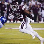 
              Mississippi State running back Dillon Johnson (23) runs past Kentucky defensive back Yusuf Corker (29) on his way to a nine-yard touchdown run during the first half of an NCAA college football game in Starkville, Miss., Saturday, Oct. 29, 2021. (AP Photo/Rogelio V. Solis)
            