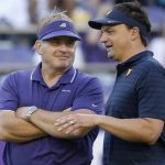 
              TCU head coach Gary Patterson, left, and West Virginia head coach Neal Brown talk on the playing field before an NCAA college football game Saturday, Oct. 23, 2021, in Fort Worth, Texas. (AP Photo/Ron Jenkins)
            
