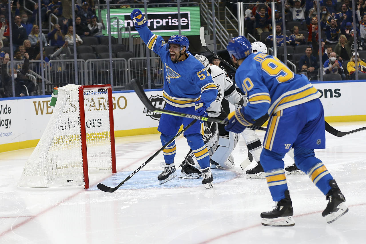St. Louis Blues' David Perron (57) celebrates after scoring a goal during the second period of an N...