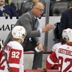 
              Detroit Red Wings head coach Jeff Blashill, center, gives instructions during the first period of a preseason NHL hockey game against the Pittsburgh Penguins in Pittsburgh, Sunday, Oct. 3, 2021. (AP Photo/Gene J. Puskar)
            