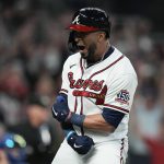 
              Atlanta Braves' Eddie Rosario celebrates after hitting a three run home run during the fourth inning in Game 6 of baseball's National League Championship Series against the Los Angeles Dodgers Saturday, Oct. 23, 2021, in Atlanta.(AP Photo/Ashley Landis)
            