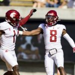 
              Washington State wide receiver Calvin Jackson Jr. (8) celebrates with wide receiver Travell Harris (1) after scoring a touchdown against California in the first quarter of an NCAA college football game in Berkeley, Calif., Saturday, Oct. 2, 2021. (AP Photo/John Hefti)
            