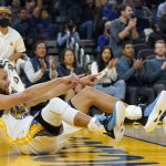 
              Golden State Warriors guard Stephen Curry celebrates after scoring against the Memphis Grizzlies during the first half of an NBA basketball game in San Francisco, Thursday, Oct. 28, 2021. (AP Photo/Jeff Chiu)
            