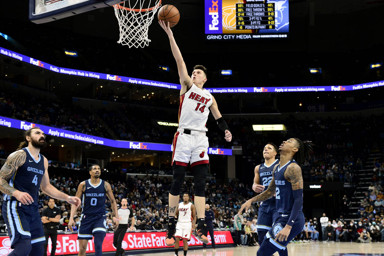 Miami Heat guard Tyler Herro (14) shoots during the first half of the team's NBA basketball game ag...