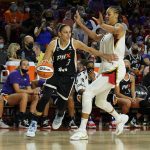 
              Phoenix Mercury guard Diana Taurasi (3) drives against Las Vegas Aces center Liz Cambage during the first half of a WNBA basketball game Sunday, Oct. 3, 2021, in Phoenix. (AP Photo/Rick Scuteri)
            