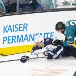 
              Winnipeg Jets right wing Blake Wheeler (26) reaches for the puck as he falls next to San Jose Sharks defenseman Jaycob Megna (24) during the third period of an NHL hockey game Saturday, Oct. 30, 2021, in San Jose, Calif. (AP Photo/D. Ross Cameron)
            