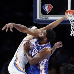 
              Philadelphia 76ers center Joel Embiid, right, blocks a shot by Oklahoma City Thunder forward Darius Bazley, left, in the first half of an NBA basketball game Sunday, Oct. 24, 2021, in Oklahoma City. (AP Photo/Nate Billings)
            