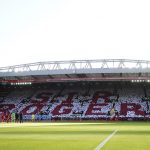 
              Liverpool and Manchester City players observe a minute's applause for former England player Roger Hunt prior to the English Premier League soccer match between Liverpool and Manchester City at Anfield, Liverpool, England, Sunday Oct. 3, 2021. (Peter Byrne/PA via AP)
            