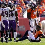 
              Denver Broncos offensive tackle Bobby Massie (70) helps quarterback Teddy Bridgewater (5) up after he was sacked against the Baltimore Ravens during the first half of an NFL football game, Sunday, Oct. 3, 2021, in Denver. (AP Photo/Jack Dempsey)
            