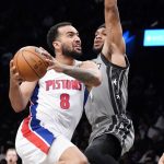 
              Detroit Pistons forward Trey Lyles (8) drives past Brooklyn Nets forward Bruce Brown during the first half of an NBA basketball game Sunday, Oct. 31, 2021, in New York. (AP Photo/Corey Sipkin)
            