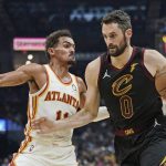 
              Cleveland Cavaliers' Kevin Love (0) drives against Atlanta Hawks' Trae Young (11) in the first half of an NBA basketball game, Saturday, Oct. 23, 2021, in Cleveland. (AP Photo/Tony Dejak)
            