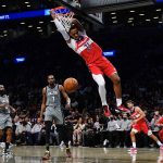 
              Washington Wizards' Daniel Gafford (21) dunks in front of Brooklyn Nets' Kevin Durant (7) during the first half of an NBA basketball game Monday, Oct. 25, 2021, in New York. (AP Photo/Frank Franklin II)
            