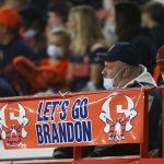 
              A sign reading "Let's go Brandon" is displayed on the railing in the first half of an NCAA college football game between Boston College and Syracuse in Syracuse, N.Y., Saturday, Oct. 30, 2021. Critics of President Joe Biden have come up with the cryptic new phrase to insult the Democratic president. (AP Photo/Joshua Bessex)
            