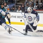 
              Winnipeg Jets goaltender Connor Hellebuyck (37) blocks a shot on goal during the first period of the team's NHL hockey game against the San Jose Sharks, Saturday, Oct. 30, 2021, in San Jose, Calif. (AP Photo/D. Ross Cameron)
            