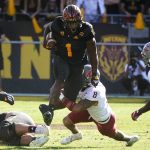 
              Washington State defensive back Armani Marsh (8) trips up Arizona State running back DeaMonte Trayanum (1) during the second half of an NCAA college football game, Saturday, Oct 30, 2021, in Tempe, Ariz. (AP Photo/Darryl Webb)
            