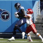 
              Tennessee Titans wide receiver A.J. Brown, left, catches a touchdown pass as he is defended by Kansas City Chiefs cornerback Mike Hughes, right, in the first half of an NFL football game Sunday, Oct. 24, 2021, in Nashville, Tenn. (AP Photo/Wade Payne)
            