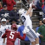
              BYU tight end Isaac Rex, right, catches a pass in front of Washington State defensive back Derrick Langford during the first half of an NCAA college football game, Saturday, Oct. 23, 2021, in Pullman, Wash. (AP Photo/Young Kwak)
            