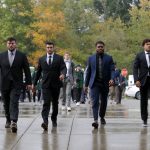 
              Michigan State players, including, from left to right, Kevin Jarvis, Cody Waddell, Brandon Wright and Connor Heyward, enter Spartan Stadium before an NCAA college football game against Western Kentucky, Saturday, Oct. 2, 2021, in East Lansing, Mich. (AP Photo/Al Goldis)
            