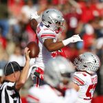 
              Ohio State running back TreVeyon Henderson (32) celebrates after scoring a touchdown against Rutgers during an NCAA college football game, Saturday, Oct. 2, 2021, in Piscataway, N.J. (AP Photo/Noah K. Murray)
            
