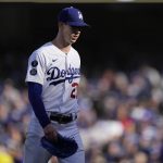 
              Los Angeles Dodgers pitcher Walker Buehler walks off the mound after being relieved in the fourth inning against the Atlanta Braves in Game 3 of baseball's National League Championship Series Tuesday, Oct. 19, 2021, in Los Angeles. (AP Photo/Jae Hong)
            