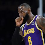 
              Los Angeles Lakers' LeBron James blows into his fist during the first half of the team's NBA basketball game against the Cleveland Cavaliers on Friday, Oct. 29, 2021, in Los Angeles. (AP Photo/Jae C. Hong)
            