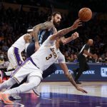 
              Los Angeles Lakers forward Anthony Davis (3) passes the ball next to Memphis Grizzlies center Steven Adams (4) during the first half of an NBA basketball game in Los Angeles, Sunday, Oct. 24, 2021. (AP Photo/Ringo H.W. Chiu)
            