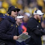 
              Michigan head coach Jim Harbaugh watches from the sideline during the second half of an NCAA college football game against Northwestern, Saturday, Oct. 23, 2021, in Ann Arbor, Mich. (AP Photo/Carlos Osorio)
            