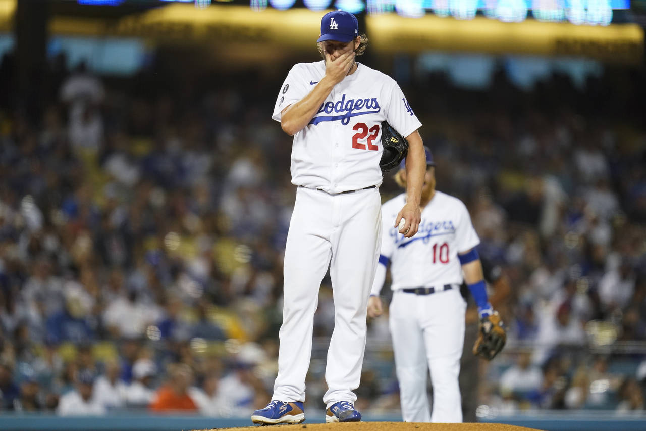 Los Angeles Dodgers starting pitcher Clayton Kershaw (22) reacts on the mound before he exits the g...