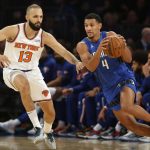 
              Orlando Magic's Jalen Suggs (4) dribbles past New York Knicks' Evan Fournier (13) during an NBA basketball game Sunday, Oct. 24, 2021, in New York. (AP Photo/John Munson)
            