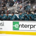 
              San Jose Sharks watch during the first period of the team's NHL hockey game against the Winnipeg Jets on Saturday, Oct. 30, 2021, in San Jose, Calif. Several San Jose players and the coach tested positive for COVID-19 before the game. (AP Photo/D. Ross Cameron)
            