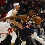 
              Utah Jazz guard Donovan Mitchell (45) drives against Chicago Bulls guard Alex Caruso, left, during the first half of an NBA basketball game Saturday, Oct. 30, 2021, in Chicago. (AP Photo/Matt Marton)
            