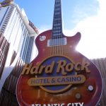 
              In this Jan. 16, 2020 photo, a giant electric guitar greets visitors at the entrance to the Hard Rock casino in Atlantic City N.J. On Tuesday, Oct. 26, 2021, Hard Rock's chairman Jim Allen said his company is interested in building a casino in New York, even as it maintains its plans to build one in northern New Jersey, which would be 8 miles from Manhattan. (AP Photo/Wayne Parry)
            
