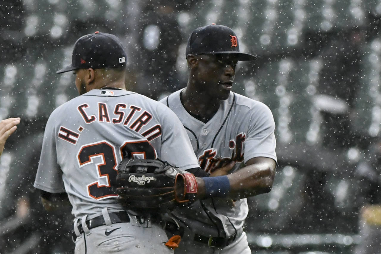 Detroit Tigers second baseman Harold Castro (30) and center fielder Daz Cameron, right, react in th...