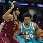 
              Charlotte Hornets' P.J. Washington (25) drives against Cleveland Cavaliers' Jarrett Allen (31) during the second half of an NBA basketball game Friday, Oct. 22, 2021, in Cleveland. Charlotte won 123-112. (AP Photo/Tony Dejak)
            