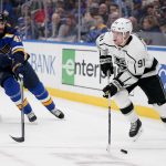 
              Los Angeles Kings' Carl Grundstrom (91) controls the puck as St. Louis Blues' Robert Bortuzzo (41) defends during the third period of an NHL hockey game Monday, Oct. 25, 2021, in St. Louis. (AP Photo/Jeff Roberson)
            