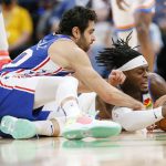 
              Oklahoma City Thunder forward Luguentz Dort, right, and Philadelphia 76ers guard Furkan Korkmaz, left, battle for control of the ball in the second half of an NBA basketball game Sunday, Oct. 24, 2021, in Oklahoma City. (AP Photo/Nate Billings)
            