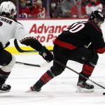 
              Carolina Hurricanes' Sebastian Aho (20) has the puck tipped away by Arizona Coyotes' Jakob Chychrun (6) during the second period of an NHL hockey game in Raleigh, N.C., Sunday, Oct. 31, 2021. (AP Photo/Karl B DeBlaker)
            