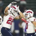 
              Fresno State defensive back Steven Comstock, left, celebrates his tackle with Mac Dalena during the first half of the team's NCAA college football game against Fresno State on Saturday, Oct. 30, 2021, in Carson, Calif. (AP Photo/Jae C. Hong)
            
