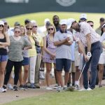 
              Spectators watch as Cameron Tringale hits after going out of bounds off the first fairway during the final round of the Sanderson Farms Championship golf tournament in Jackson, Miss., Sunday, Oct. 3, 2021. (AP Photo/Rogelio V. Solis)
            