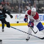 
              Montreal Canadiens left wing Artturi Lehkonen (62) moves the puck down the ice past San Jose Sharks defenseman Marc-Edouard Vlasic (44) during the second period of an NHL hockey game Thursday, Oct. 28, 2021, in San Jose, Calif. (AP Photo/Tony Avelar)
            