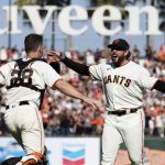 
              San Francisco Giants closing pitcher Dominic Leone, right, and catcher Buster Posey (28) react after defeating the San Diego Padres in a baseball game in San Francisco, Sunday, Oct. 3, 2021. (AP Photo/John Hefti)
            