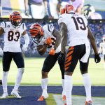 
              Cincinnati Bengals running back Joe Mixon, center, celebrates his touchdown run with wide receiver Tyler Boyd (83) and wide receiver Auden Tate (19) during the second half of an NFL football game against the Baltimore Ravens, Sunday, Oct. 24, 2021, in Baltimore. (AP Photo/Nick Wass)
            