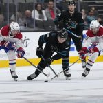 
              San Jose Sharks right wing Timo Meier (28) moves the puck up the ice between Montreal Canadiens' Mike Hoffman (68) and right wing Joel Armia (40) during the first period of an NHL hockey game Thursday, Oct. 28, 2021, in San Jose, Calif. (AP Photo/Tony Avelar)
            