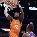 
              Phoenix Suns center Deandre Ayton (22) dunks over Los Angeles Lakers center Dwight Howard during the first half of an NBA basketball game Friday, Oct. 22, 2021, in Los Angeles. (AP Photo/Marcio Jose Sanchez)
            